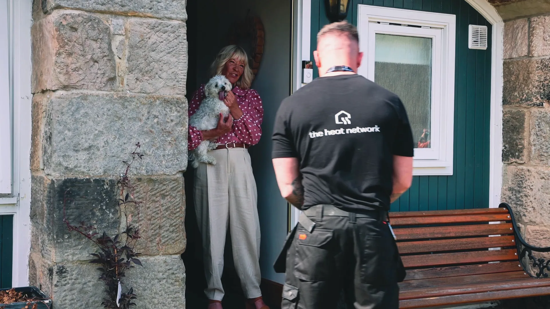 Engineer with customer at door