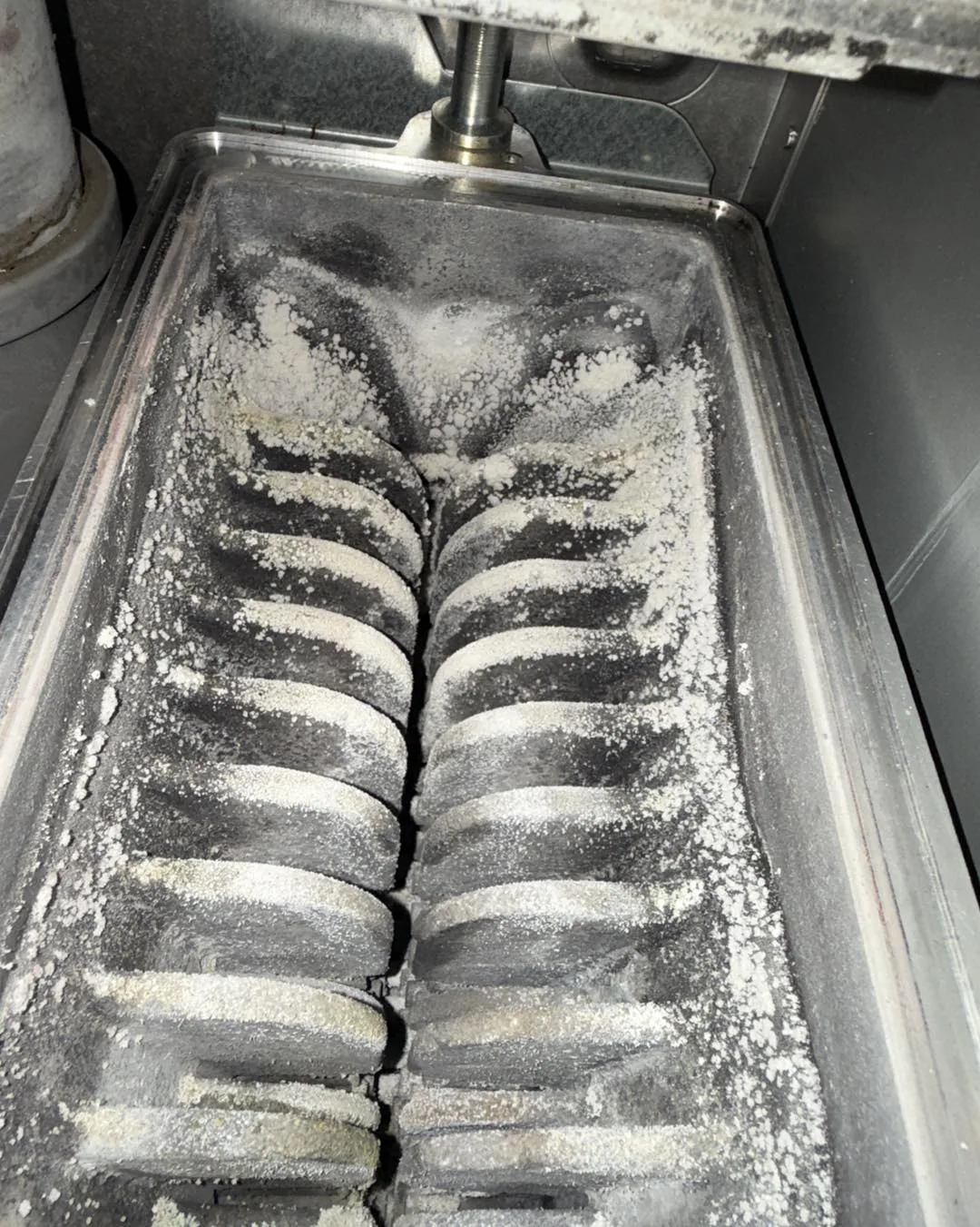 Boiler internals before servicing showing dirt buildup